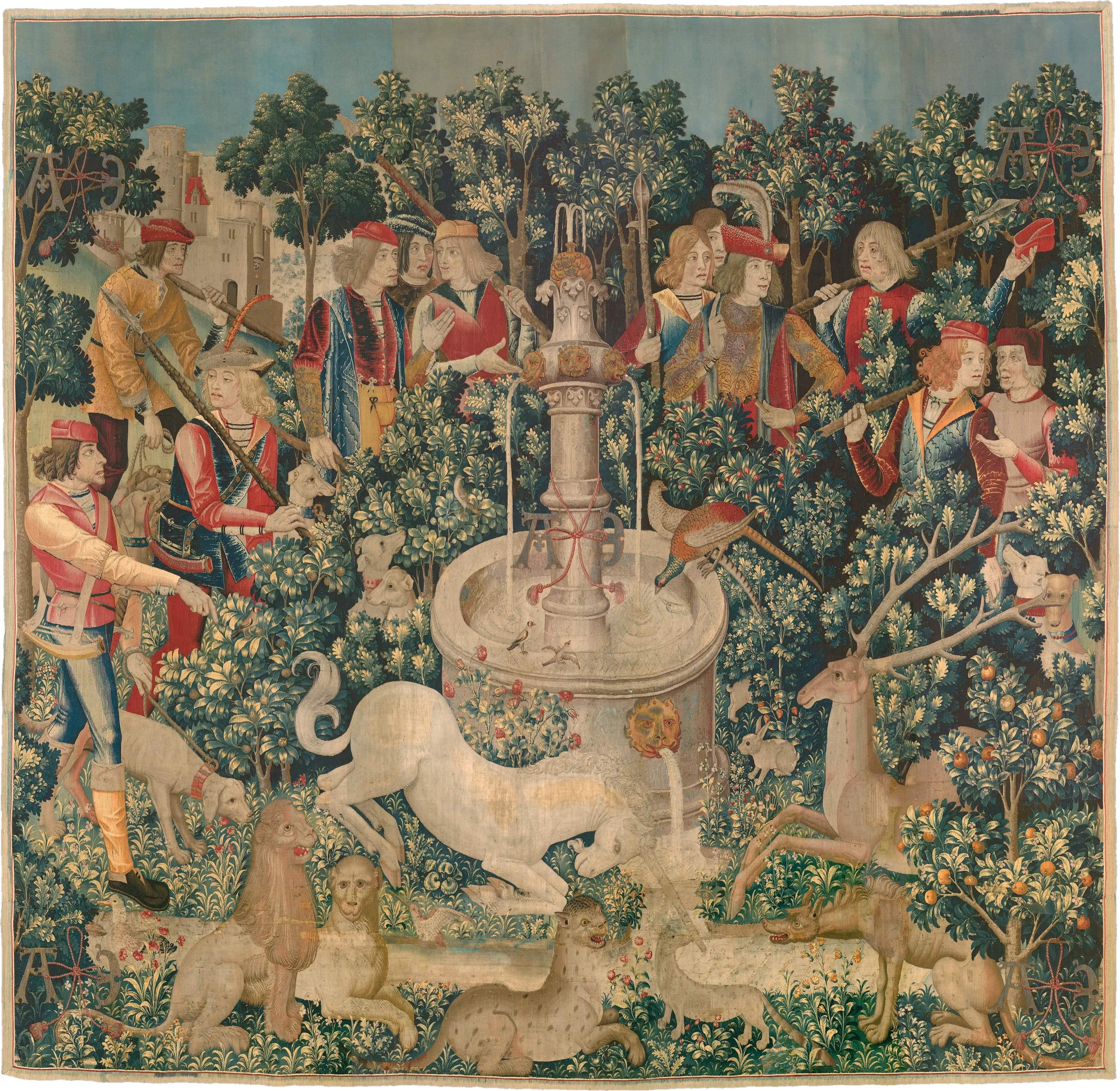 A woven hunting scene: hunters and hounds gather around a fountain where a white unicorn kneels among flowering trees.
